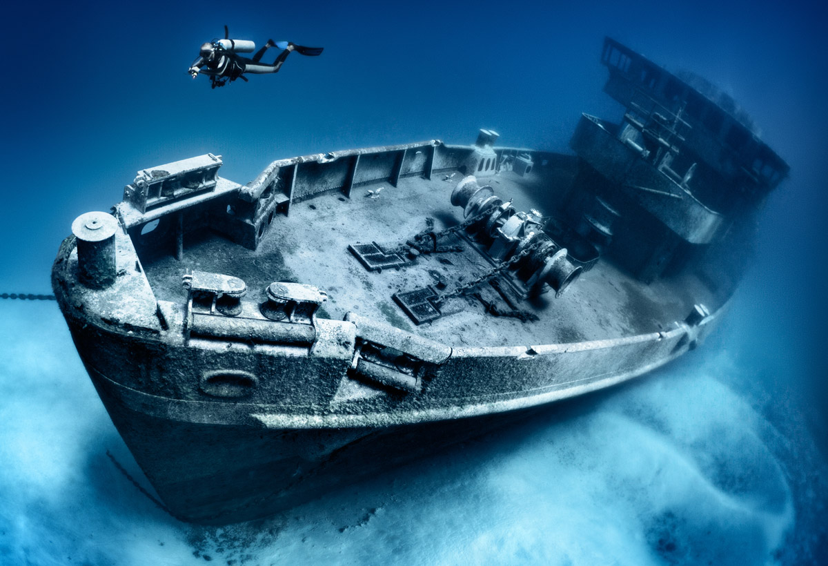Scuba diver exploring shipwreck
